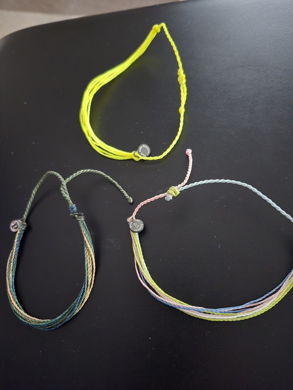 Set of Three Colorful Woven String Bracelets